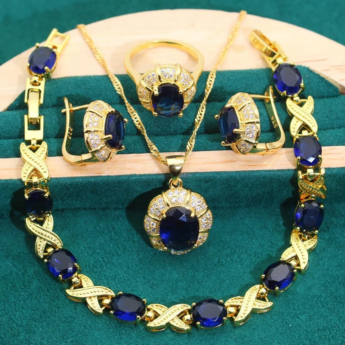 18k gold plated zircon jewellery set showing ring, earrings, bracelet and necklace in a coordinating colour.