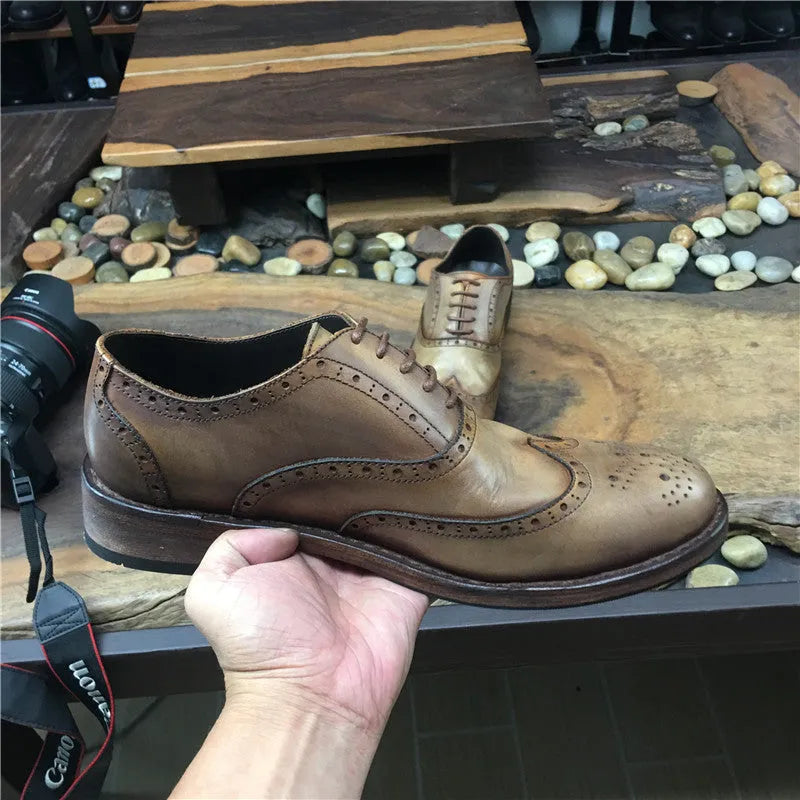 Men's light brown distressed leather shoes with vintage engraved detailing and round toe