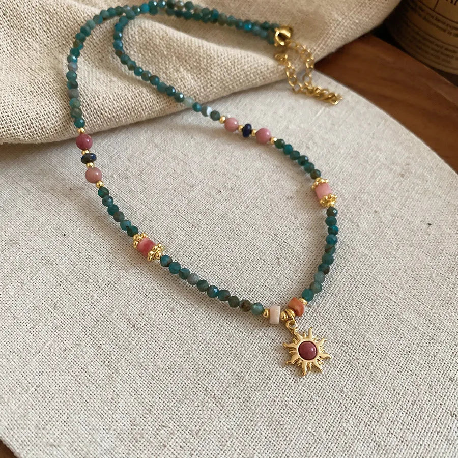 Freshwater pearl necklace with stone sun pendant on adjustable clavicle chain