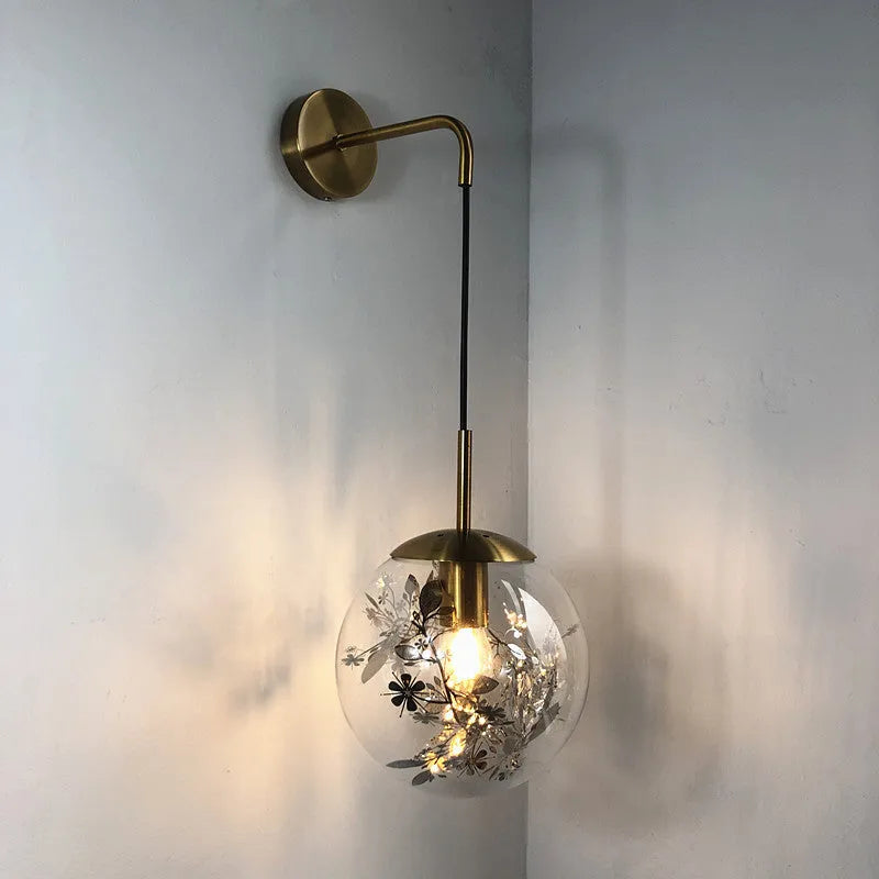Modern glass wall lamp with minimalist design shown in bedroom setting