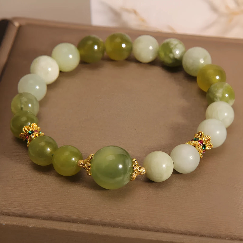 Women's bracelet made of green Xiuyan jade with an original sweet Mori style design.