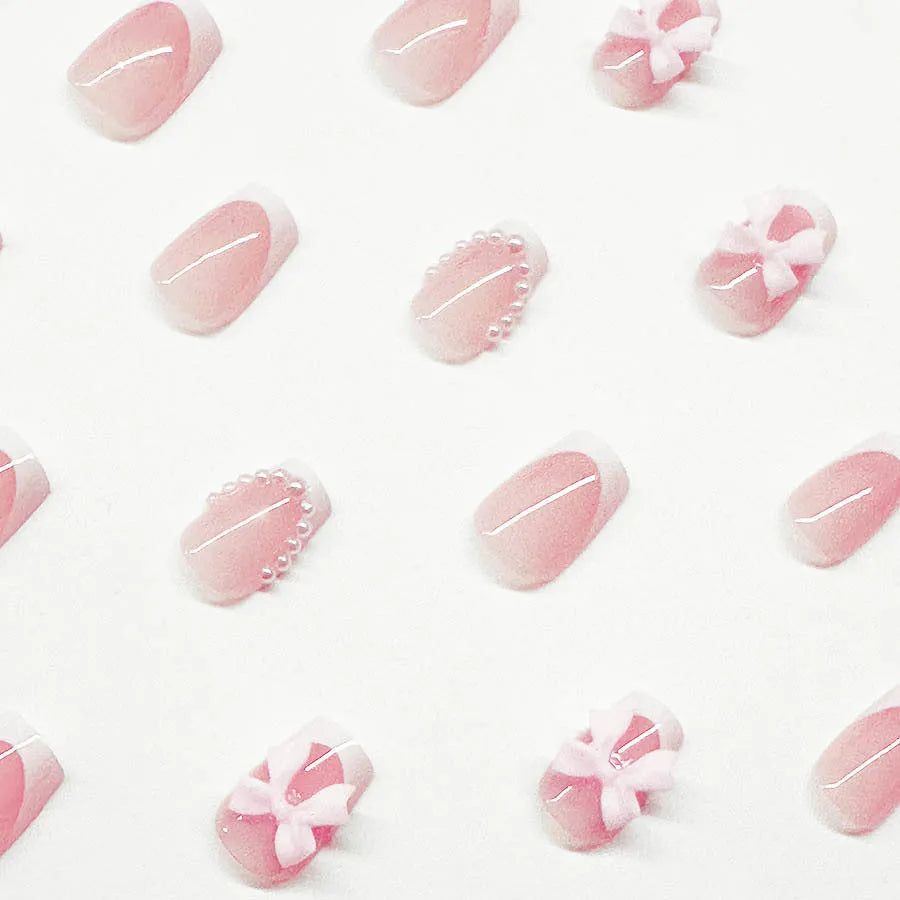 Short French manicure nail art set with multiple patterns including tulips, bows, starry sky, leopard print and XINGX designs