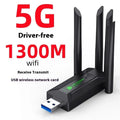 Black USB network transmitter with four antennas for computer signal coverage