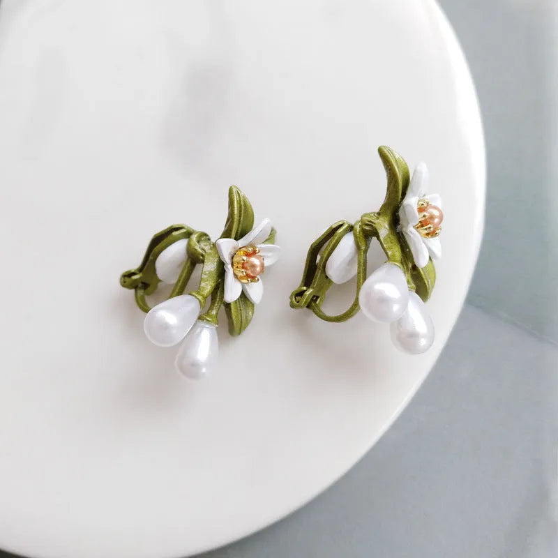 Women's camellia flower earrings set with sterling silver needle design in contrasting colours