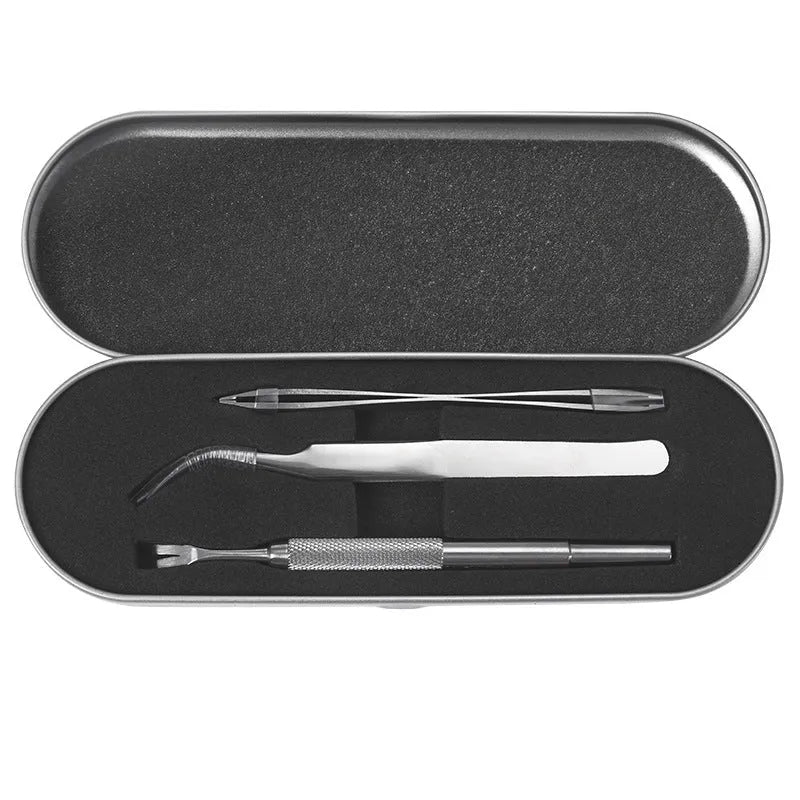 Three silver stainless steel tick clips with grate-style heads for pet parasite removal
