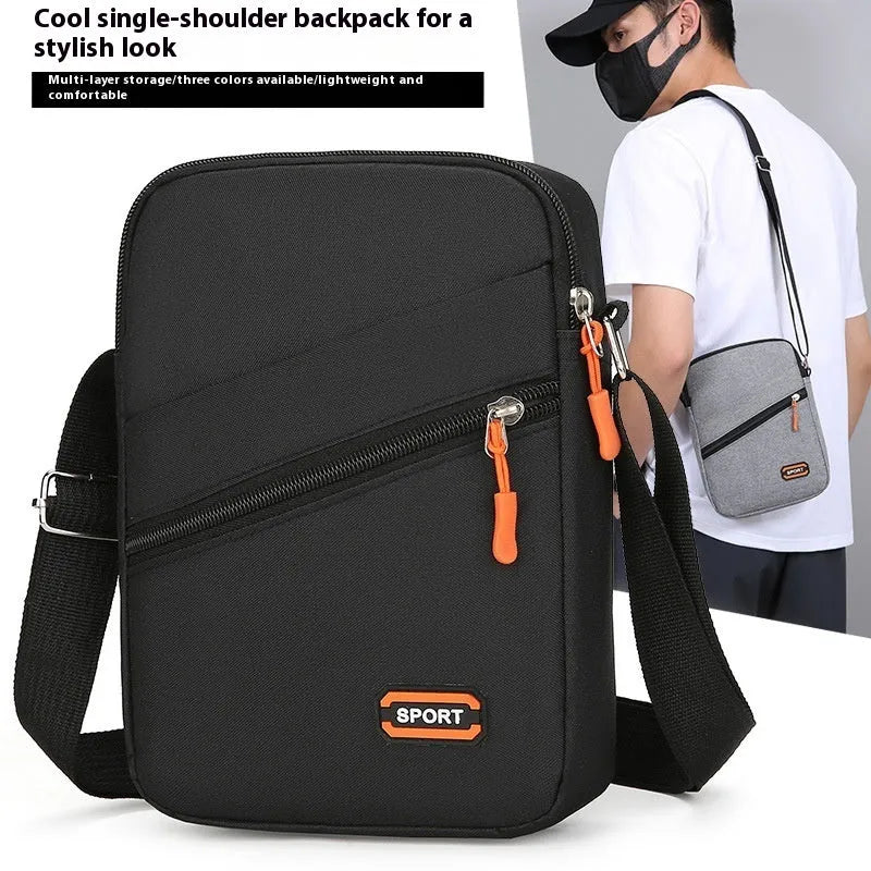 Lightweight Oxford cloth crossbody commuter bag in a solid colour with contrast detailing.