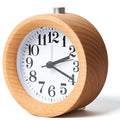 Solid beech wood silent snooze alarm clock showing wooden case and clear dial.