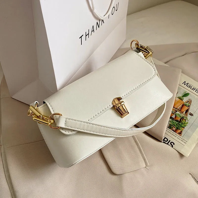 Brown French casual underarm bag with single shoulder chain, showing horizontal square shape and sandwich pocket design