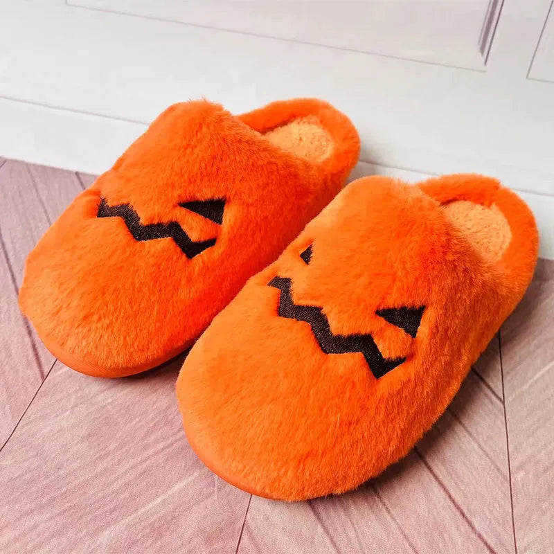 Orange Halloween pumpkin slippers with coral velvet exterior and plush lining