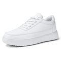 Women's white leather lace-up casual flat shoes on a plain background.