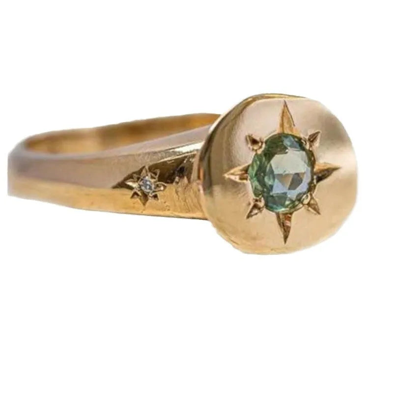 Golden adjustable ring with oval face featuring detailed star inlay design