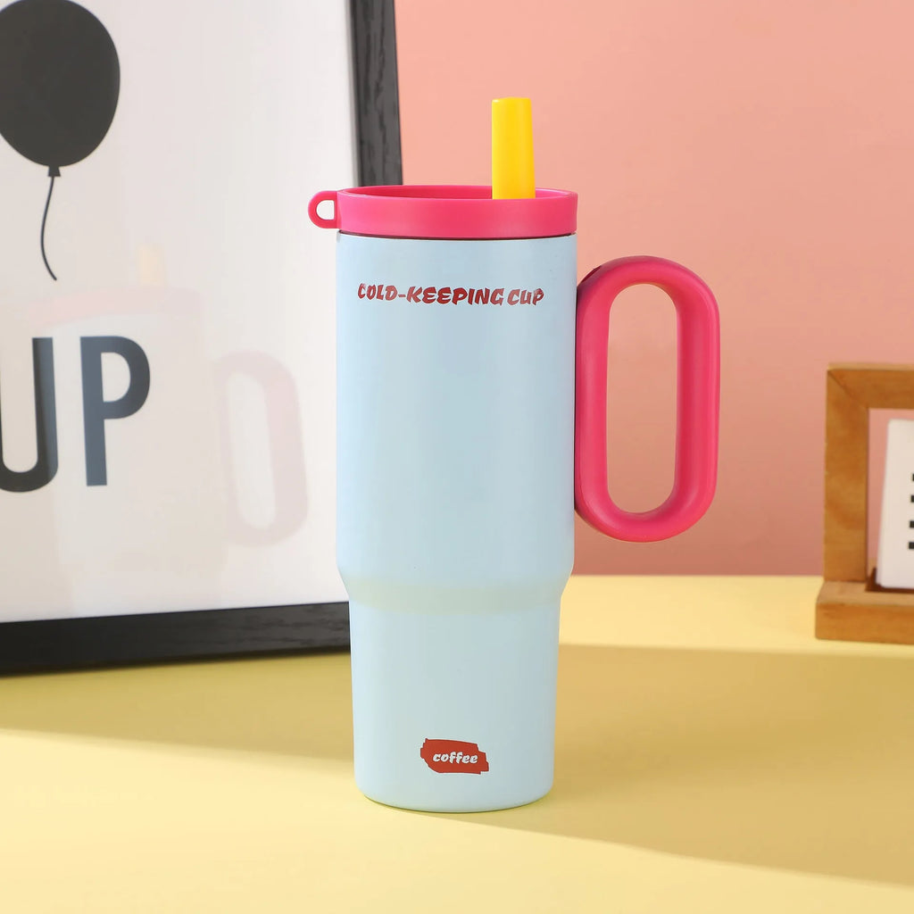 Insulated tumbler cup with a carrying handle and a straw, shown in one of five colour options.