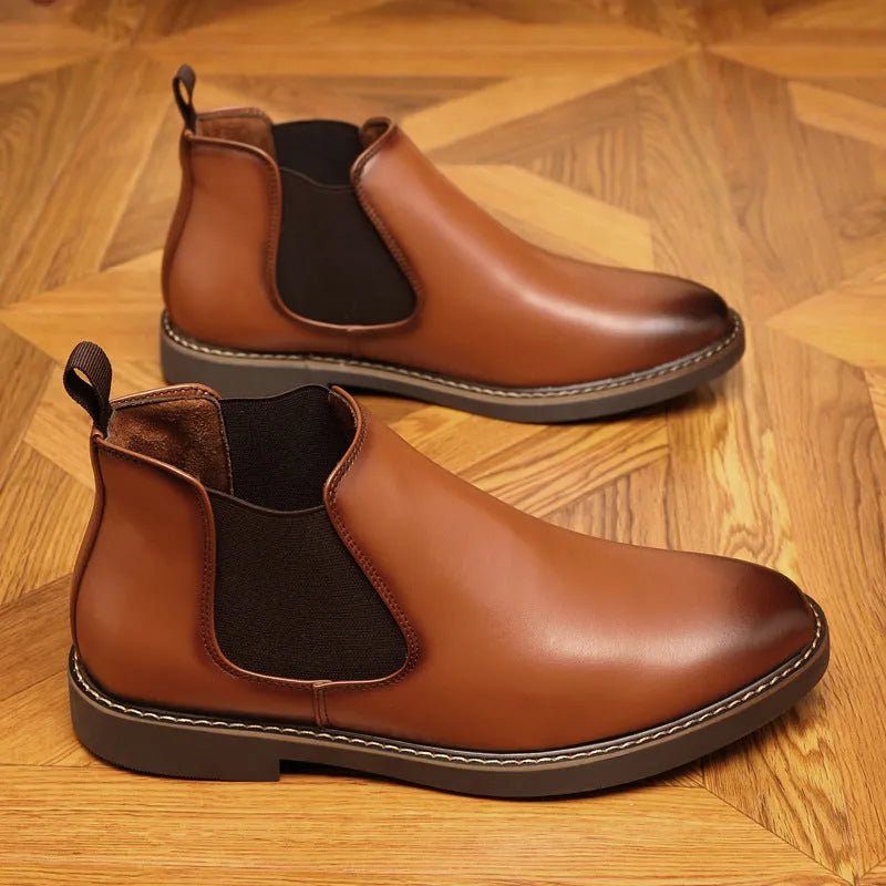 Men's black formal pointed-toe leather boots with a square heel and rubber sole on a plain background.