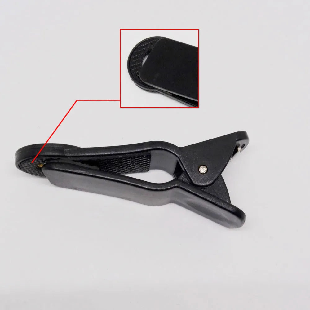12x magnification smartphone telephoto lens with universal collar clip attached to a mobile phone