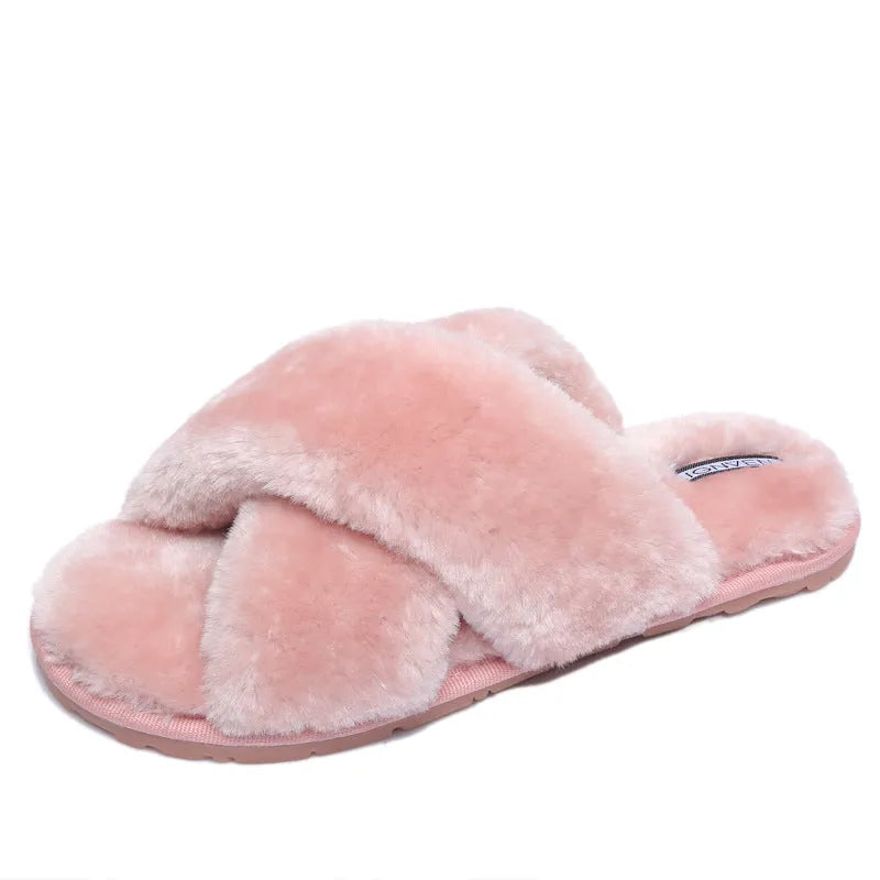 Women's black cross open-toe fur slippers showing the patterned non-slip sole and strap design.