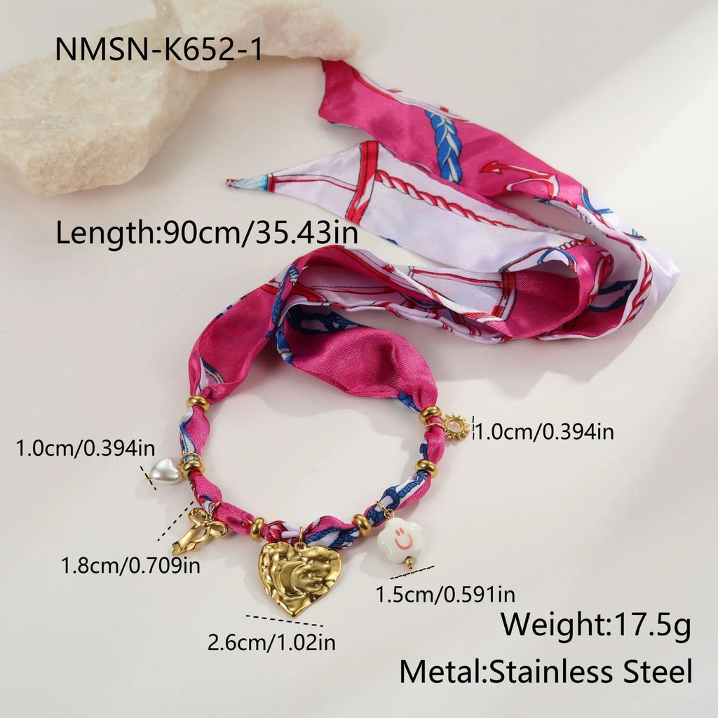 Stainless steel necklace and bracelet set with geometric love pendant designs in 18K gold plating