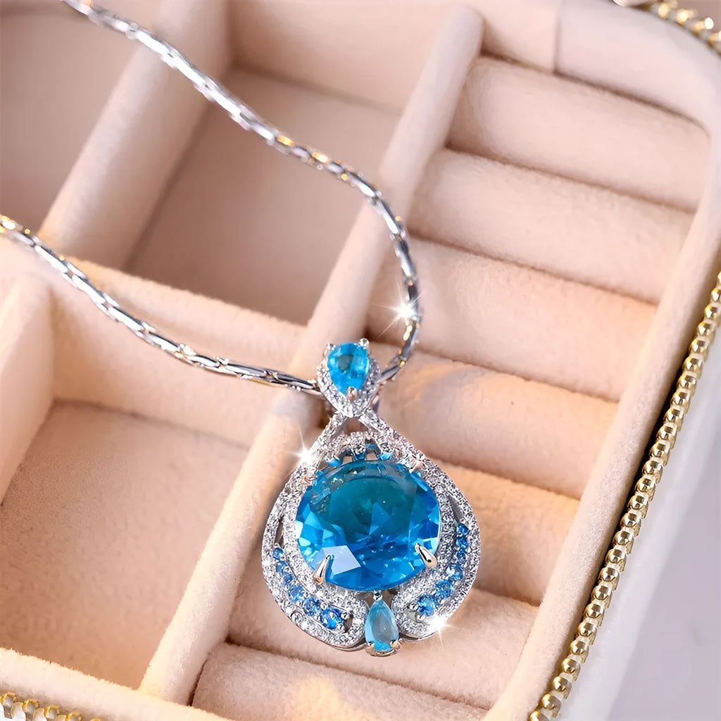 Blue geometric pendant necklace with fireworks-cut crystals on water wave chain
