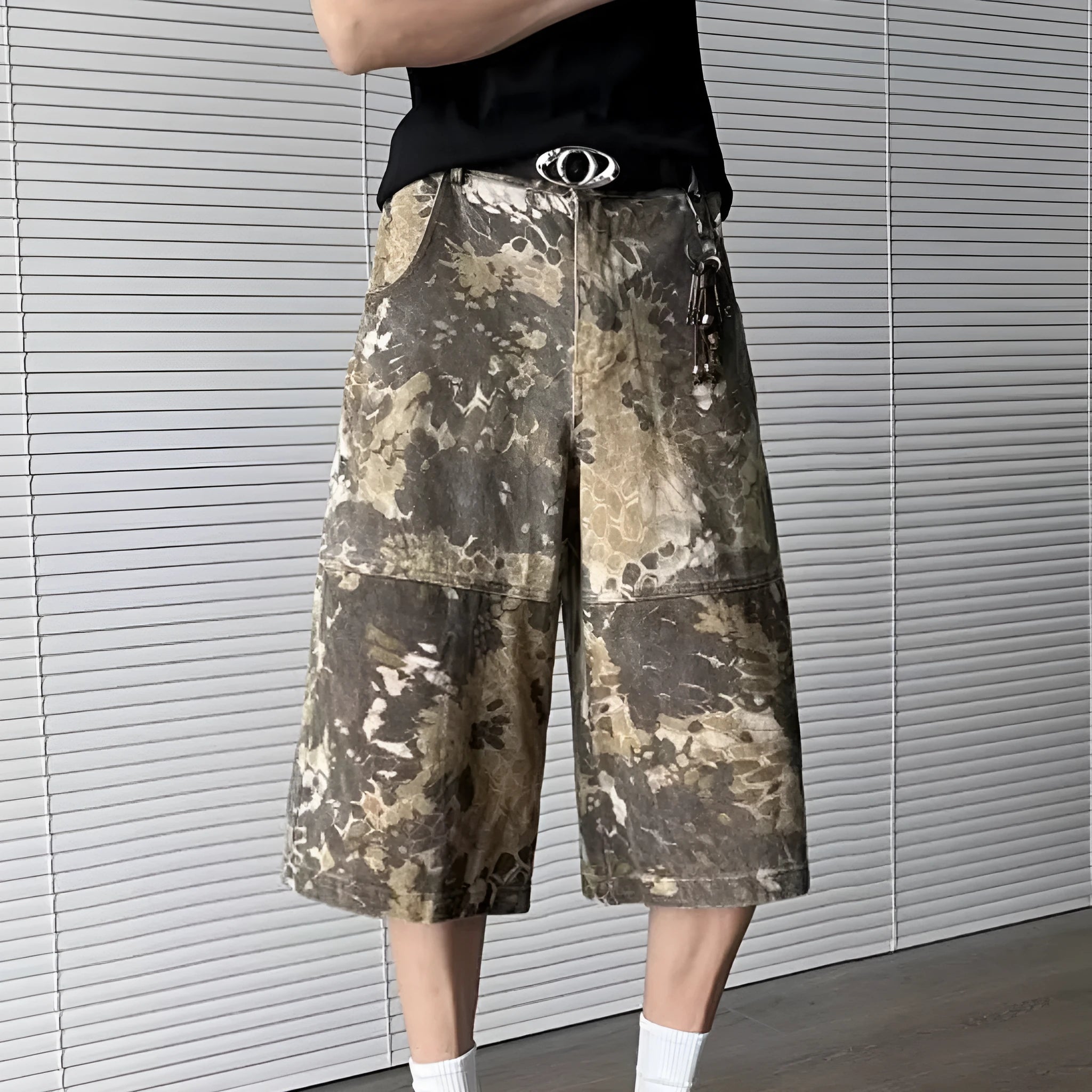 Yellow snake pattern camouflage cropped jeans on a denim background