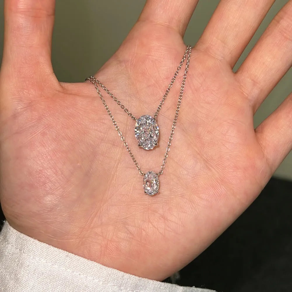 Oval ice flower geometric pendant on a sterling silver necklace with a choice of platinum or gold electroplated finish.