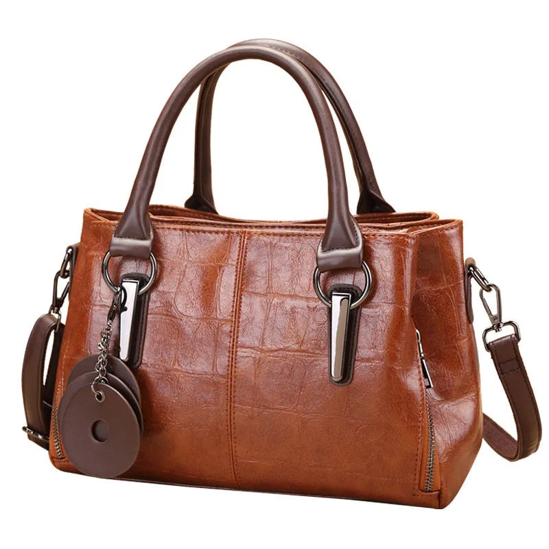 Horizontal square PU leather shoulder bag with contrasting stitching showing internal compartments including mobile phone section