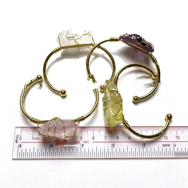 Natural crystal rough stone bracelet with gold metal winding in a geometric bohemian design