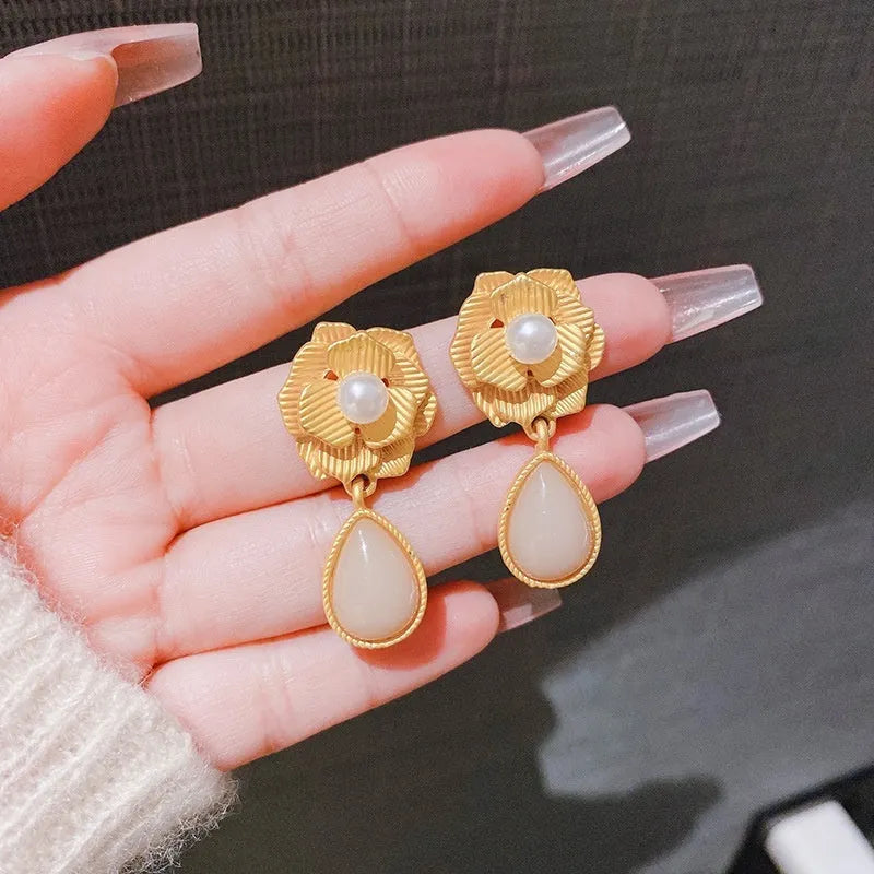 Gold Hong Kong style floral stud earrings with pearl and opal decoration