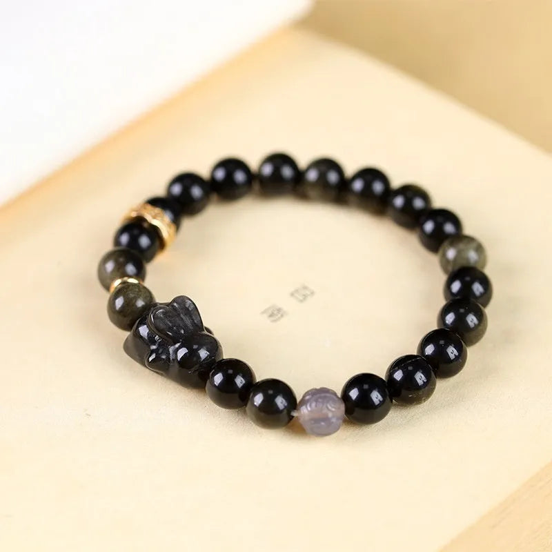 Handmade lying rabbit charm obsidian bracelet in Jin Yaoshi with gray agate details, national style unisex jewellery.