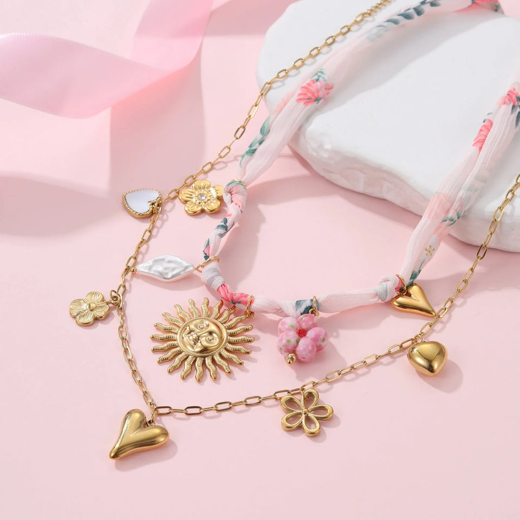 Stainless steel geometric pendant necklace with adjustable chain and 18K gold electroplated finish