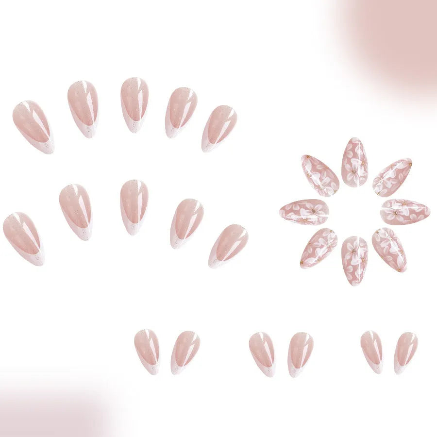 Glossy almond shaped press-on nails with French style white tips and glitter powder floral design in C625 pattern