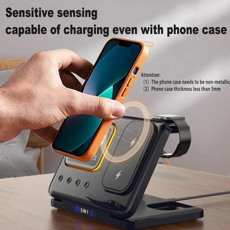 Black 15W wireless charging dock with phone, Apple Watch, and headphones on charging pads, showing LED digital clock display.