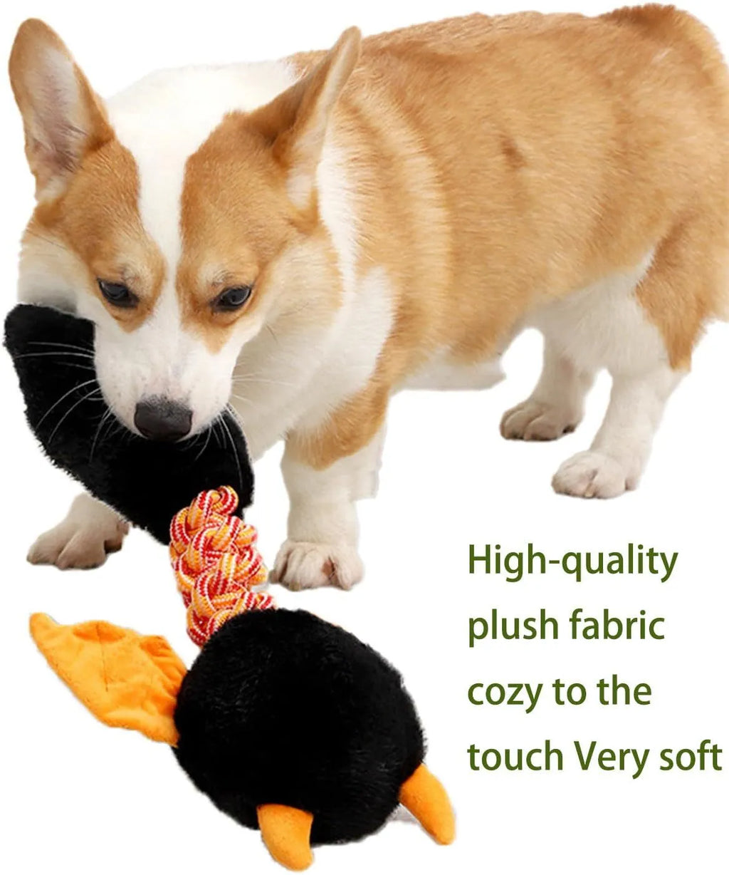 Large green plush dog toy with rope knot and cartoon design on a white background.