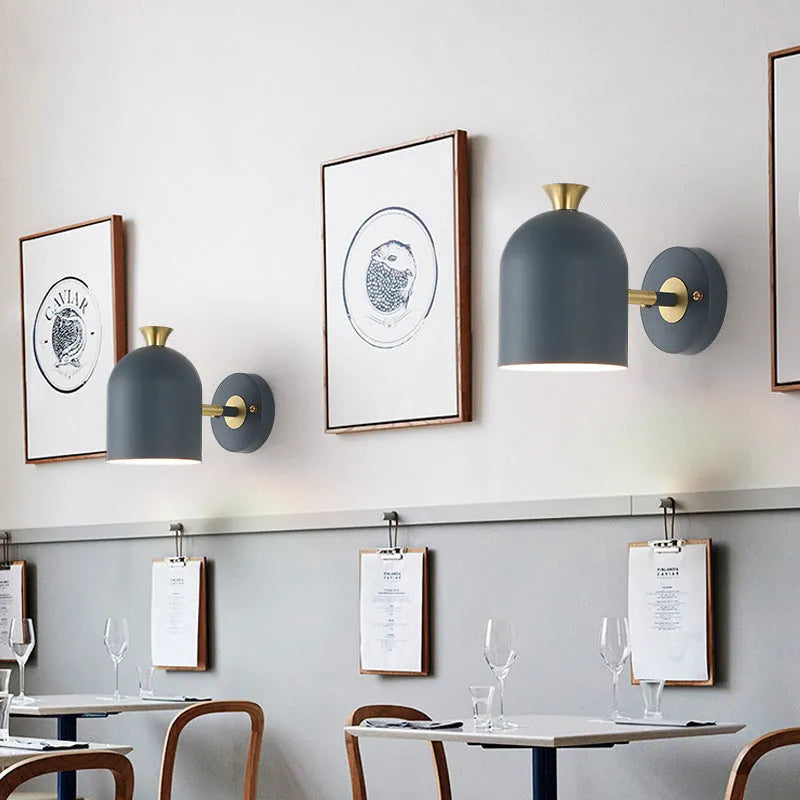 Single-head aluminium wall lamp with mirror front in choice of yellow, green, blue, or pink light.