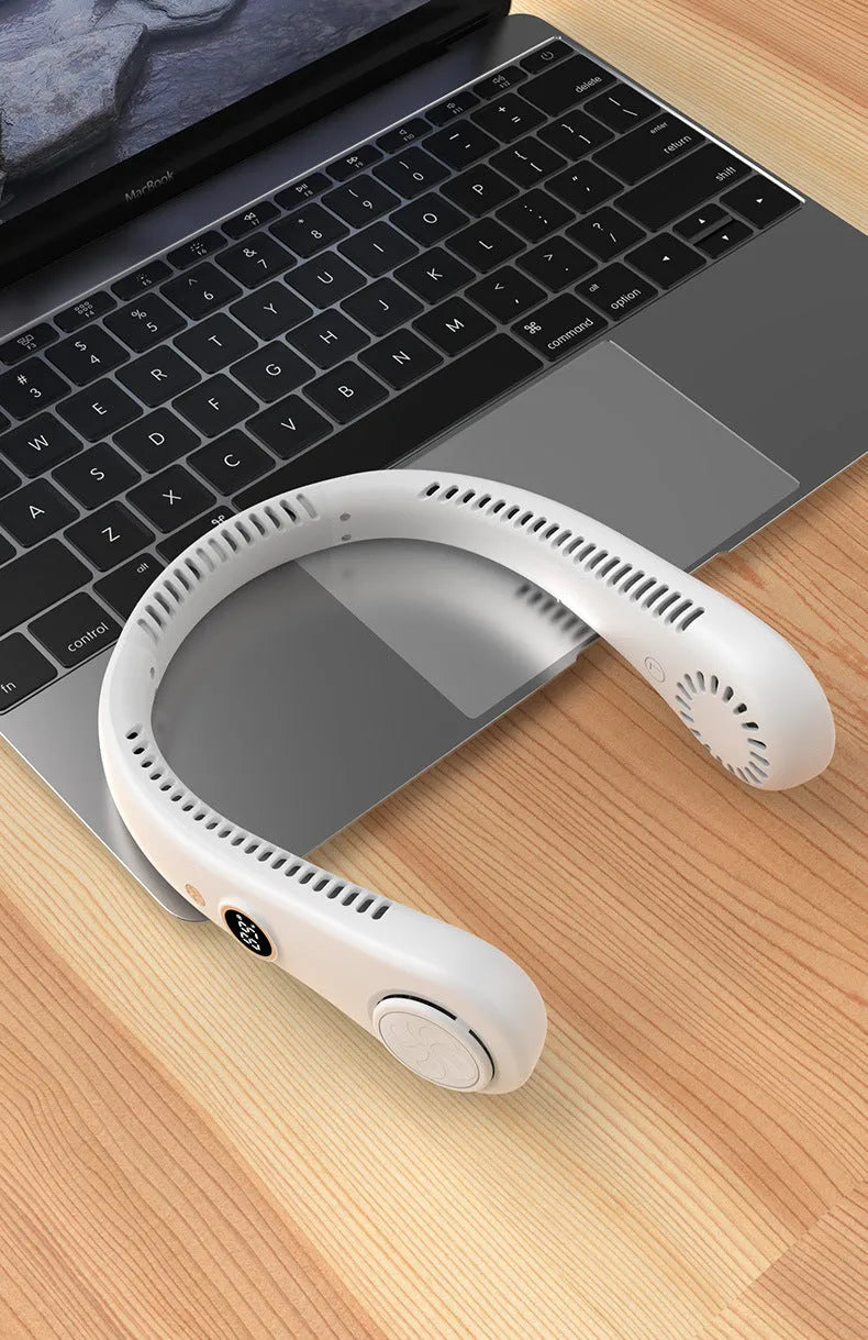Blue bladeless neck fan hanging around a person's neck, showing USB charging port and control buttons.