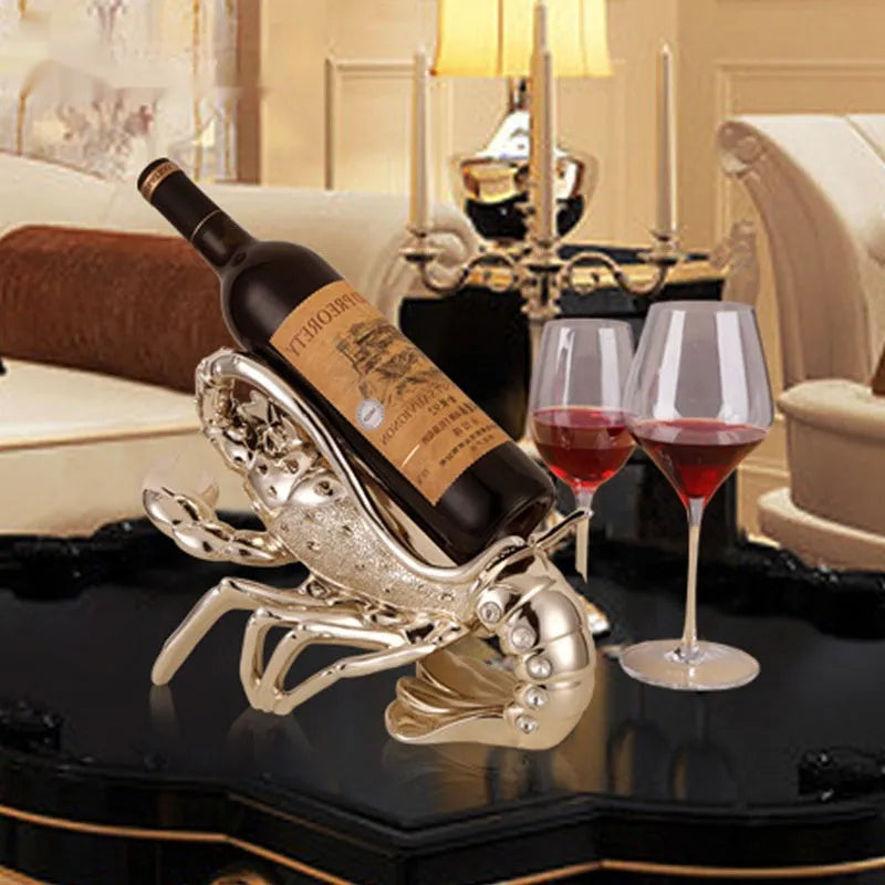 Lobster-shaped wine rack ornament in metallic finish displaying wine bottle