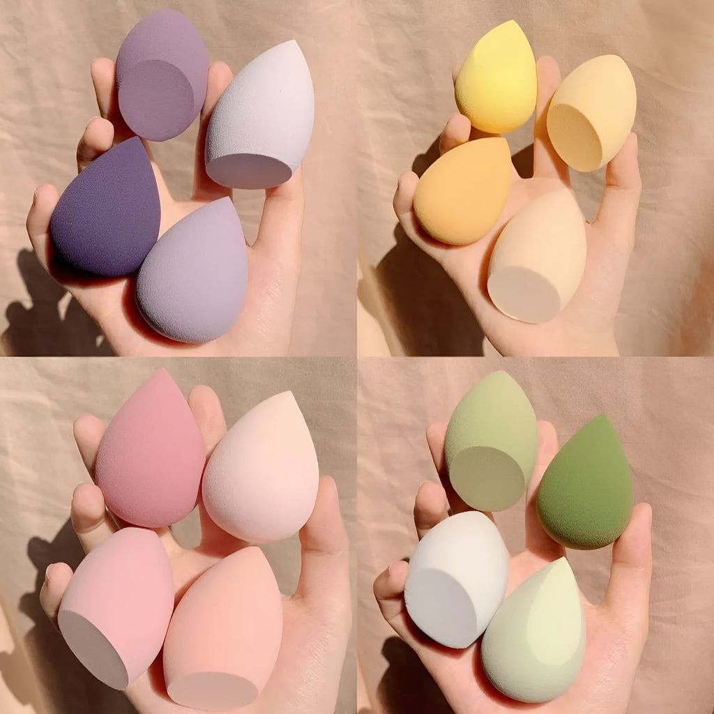 Makeup egg box with four coloured synthetic sponge beauty blenders, each roughly 6cm in size.