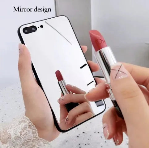 Black iPhone case with a mirrored back panel, shown next to an iPhone.
