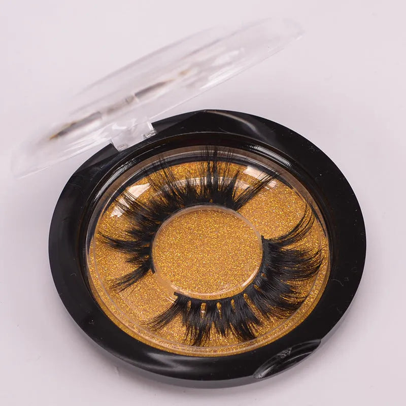 5D Mink False Eyelashes set with hair cap and double-headed brush on a pink background.