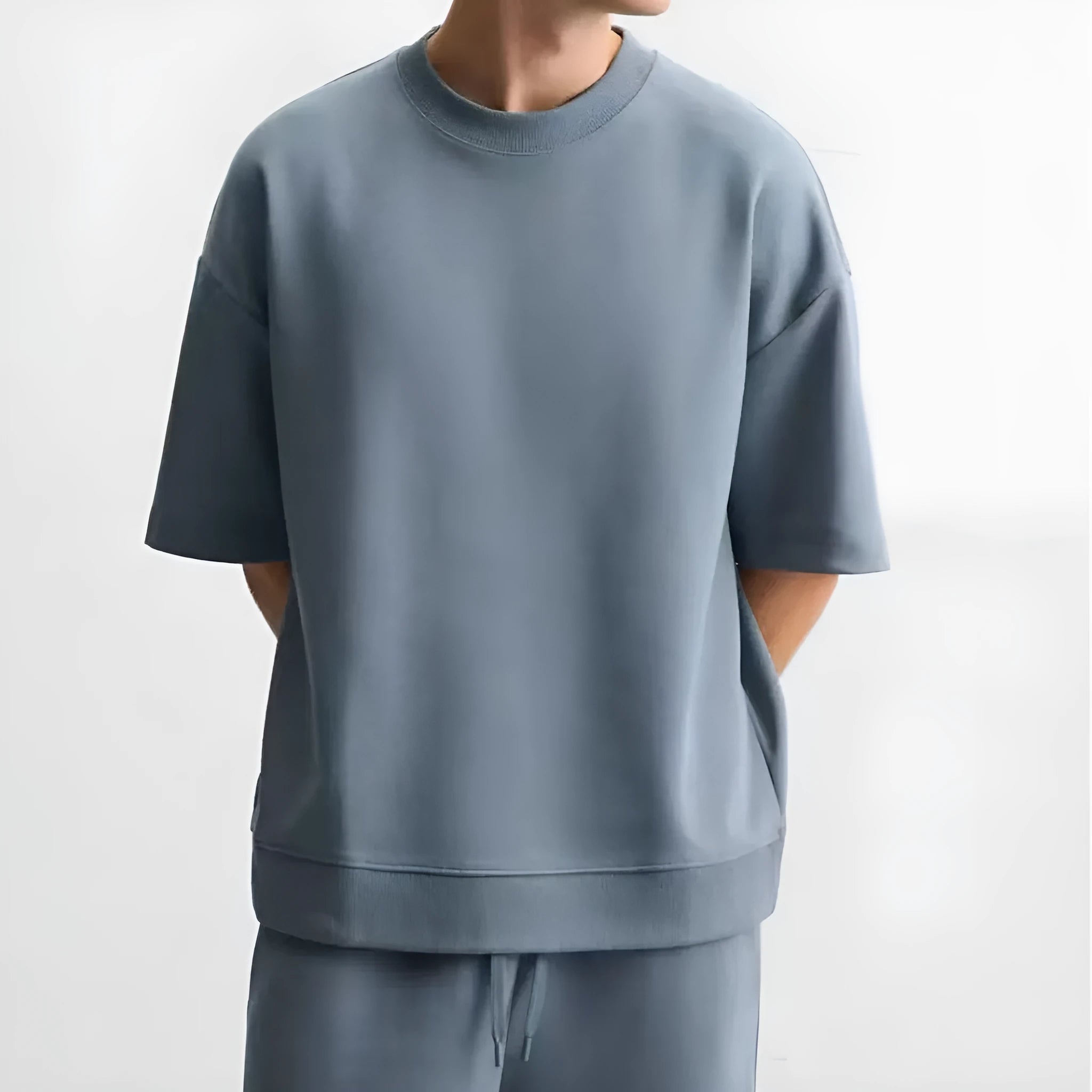 Loose double-sided cloth texture short sleeve top and matching shorts casual set on a hanger.