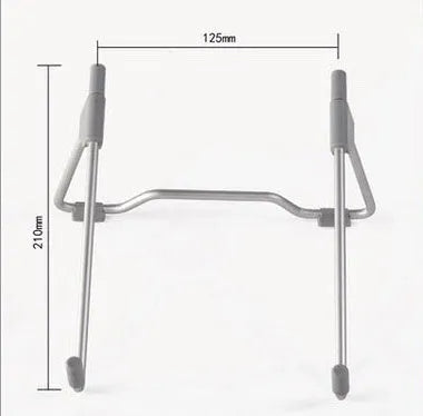 Grey aluminium and plastic adjustable stand holding a mobile phone and a laptop on a desk.