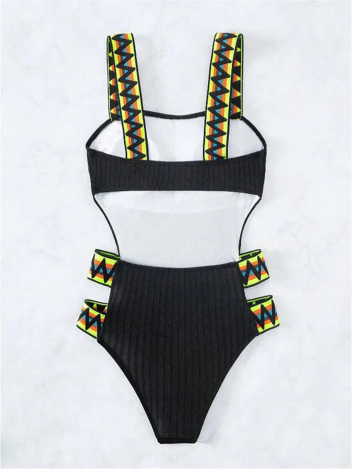 Women's solid colour one-piece swimsuit in black or orange options with polyester construction