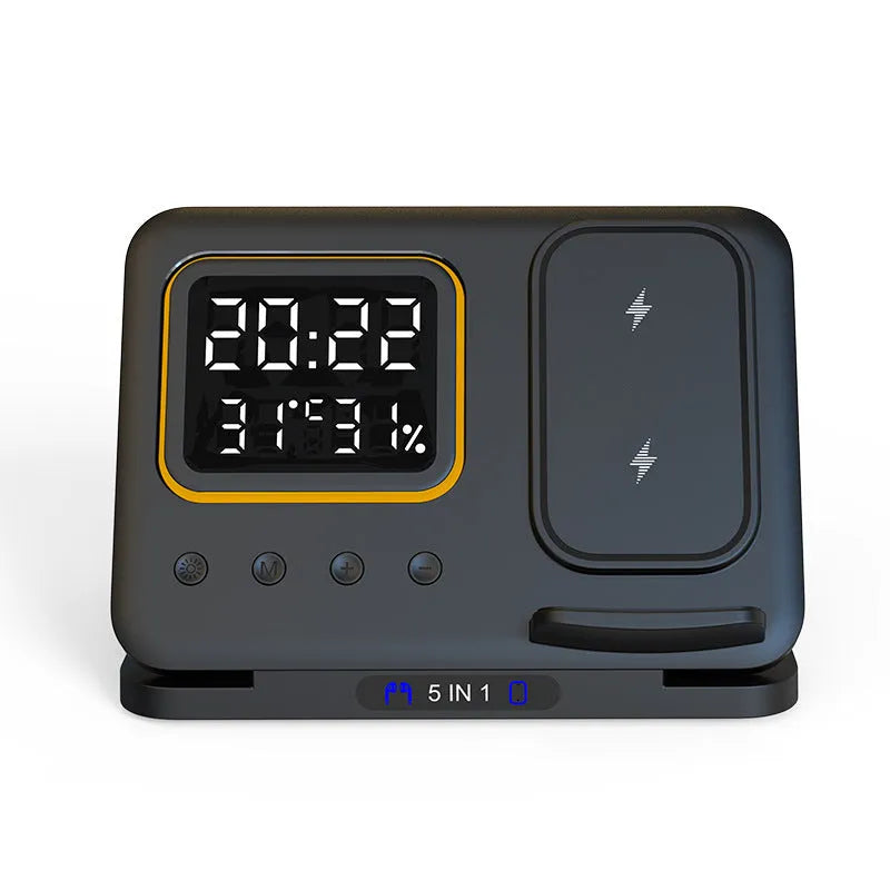 Black 15W wireless charging dock with phone, Apple Watch, and headphones on charging pads, showing LED digital clock display.