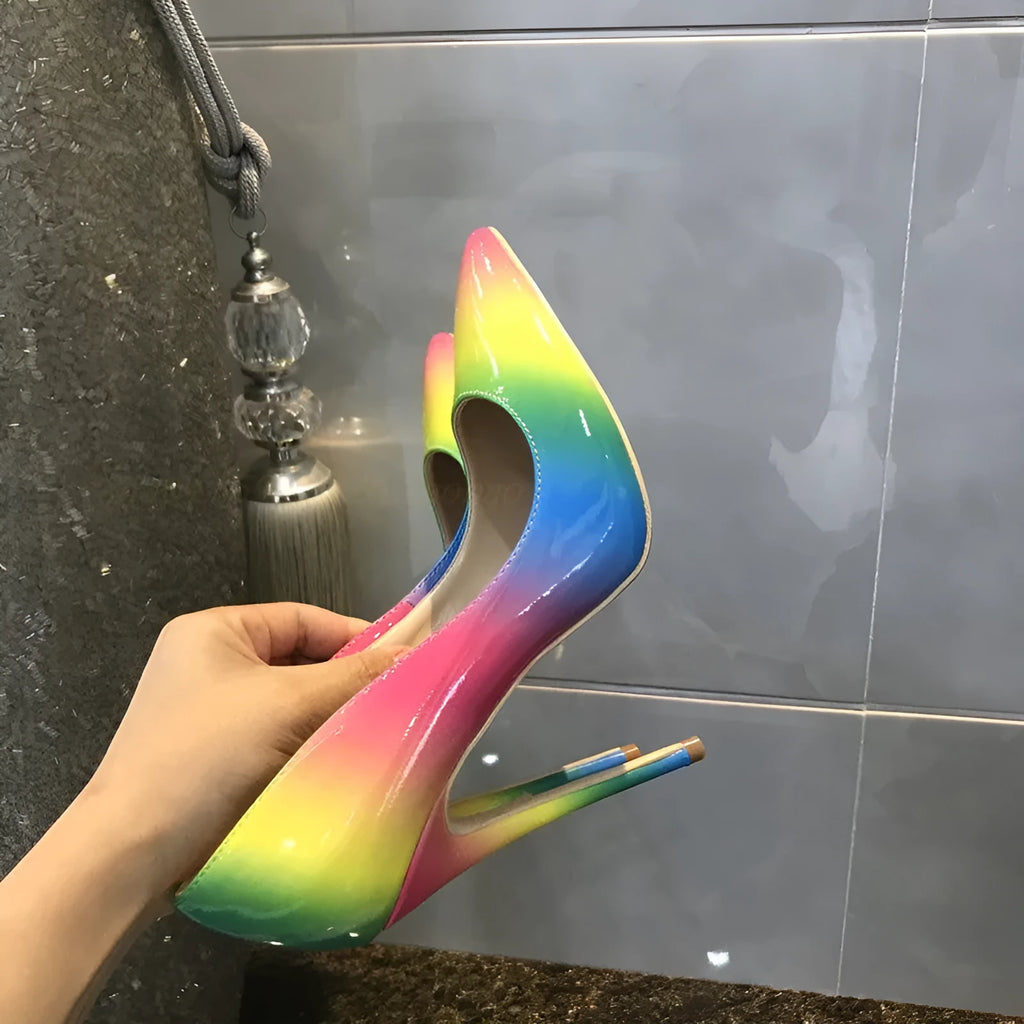 Rainbow coloured patent leather women's high heels with pointed toe and thin ultra-high heel.