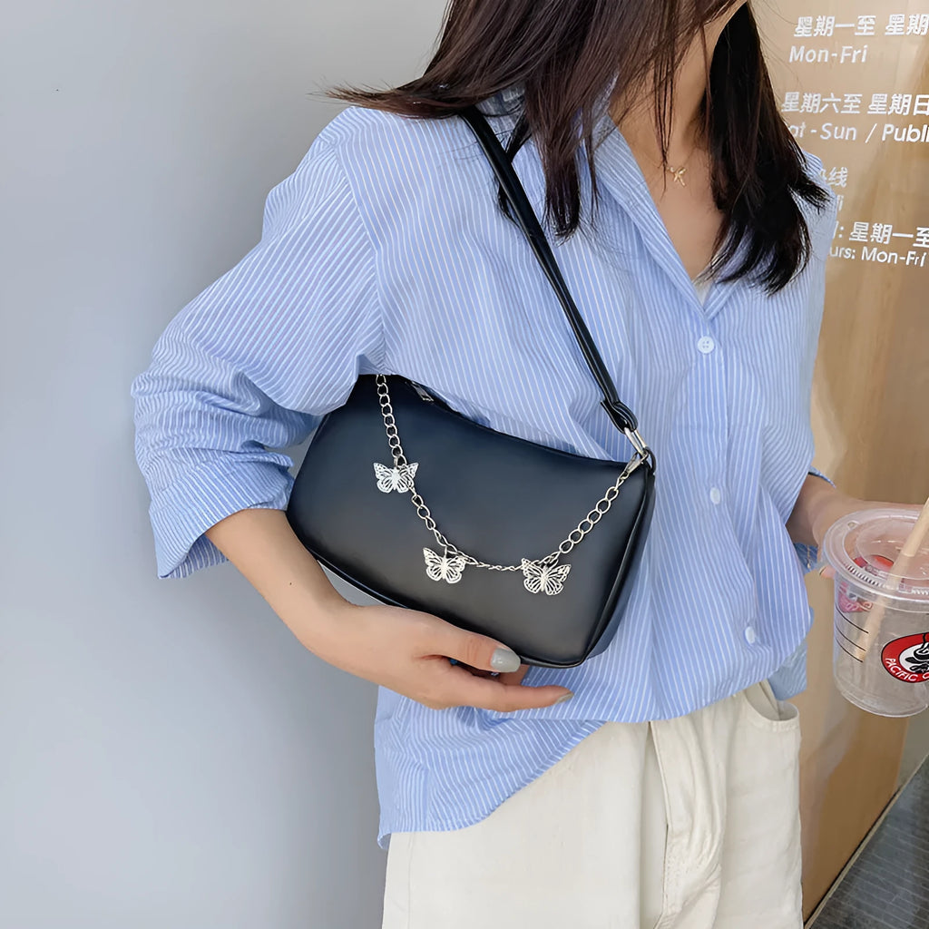 Women's black butterfly chain underarm bag with retro styling and three-dimensional pocket