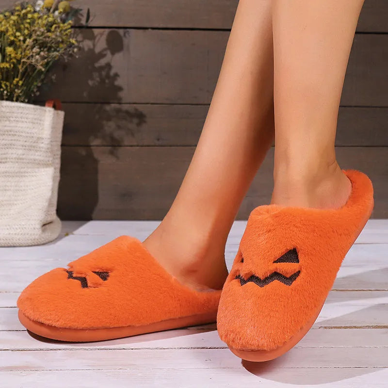 Orange Halloween pumpkin slippers with coral velvet exterior and plush lining