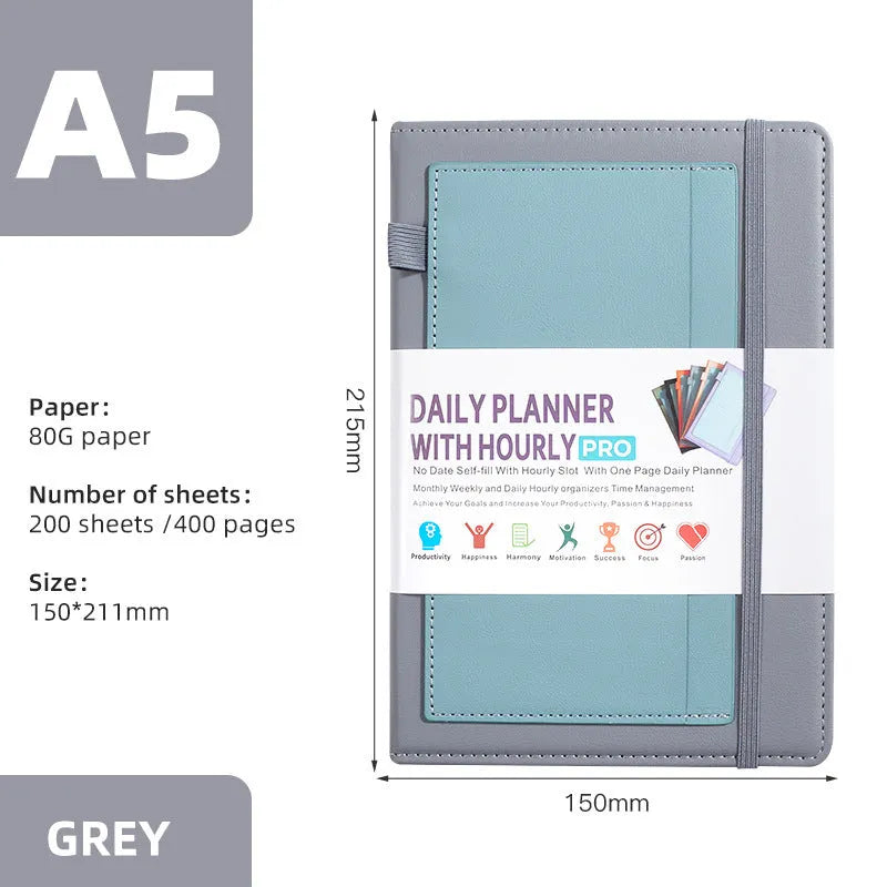 A6 self-filled notebook with PU cover in various colours, shown open on wooden table.