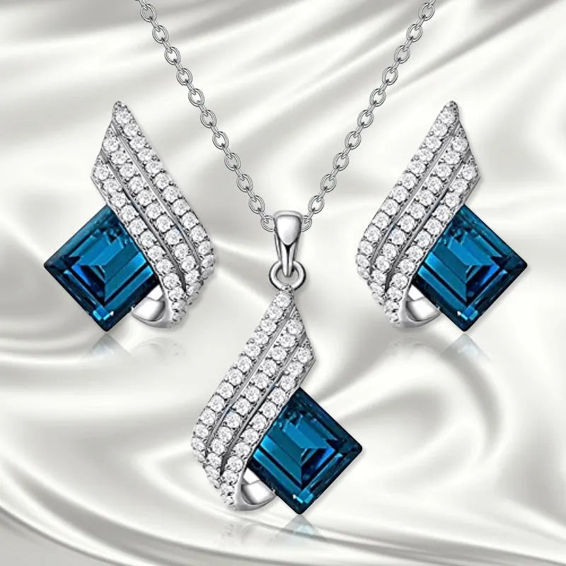 Women's necklace and earring set with glass pendant on cross chain, alloy material with electroplated finish