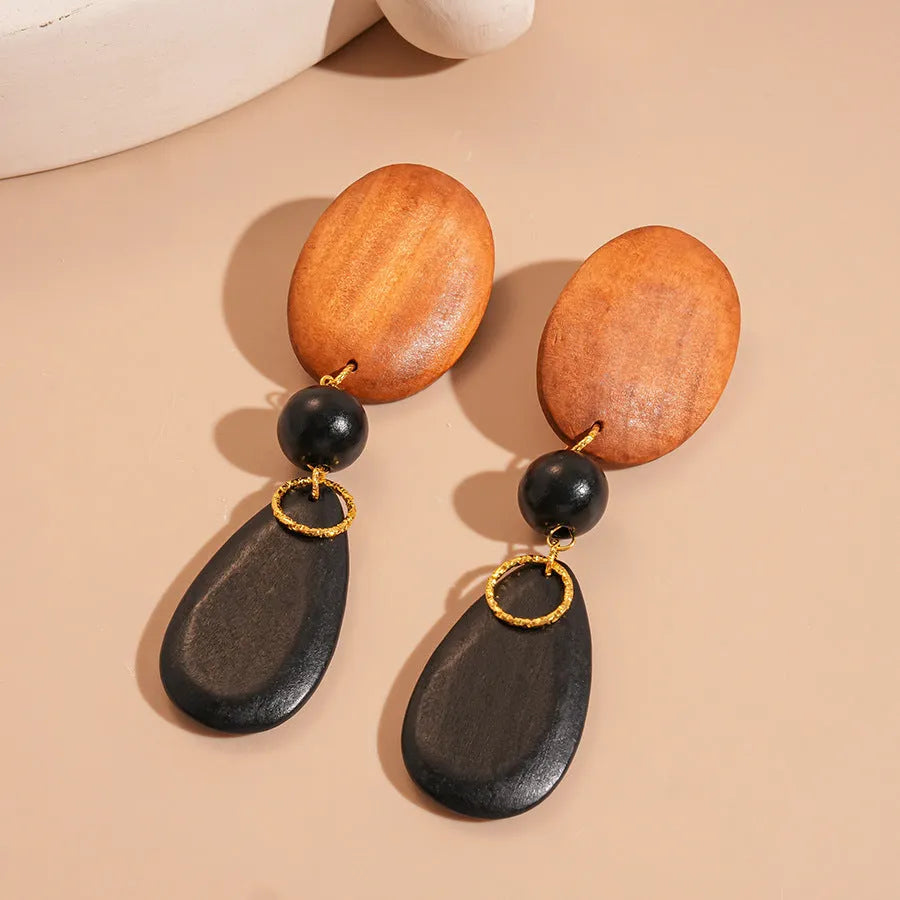 Handmade wooden retro earrings with elliptical design in silver-brown-black colours