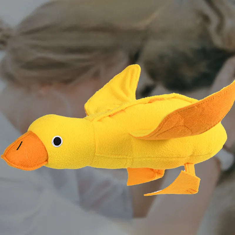 Yellow teddy fabric duck-shaped dog toy with squeaker and hidden food compartment