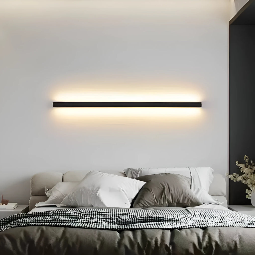 80cm long black simple strip LED wall lamp with touch control for three light colours on a wall.