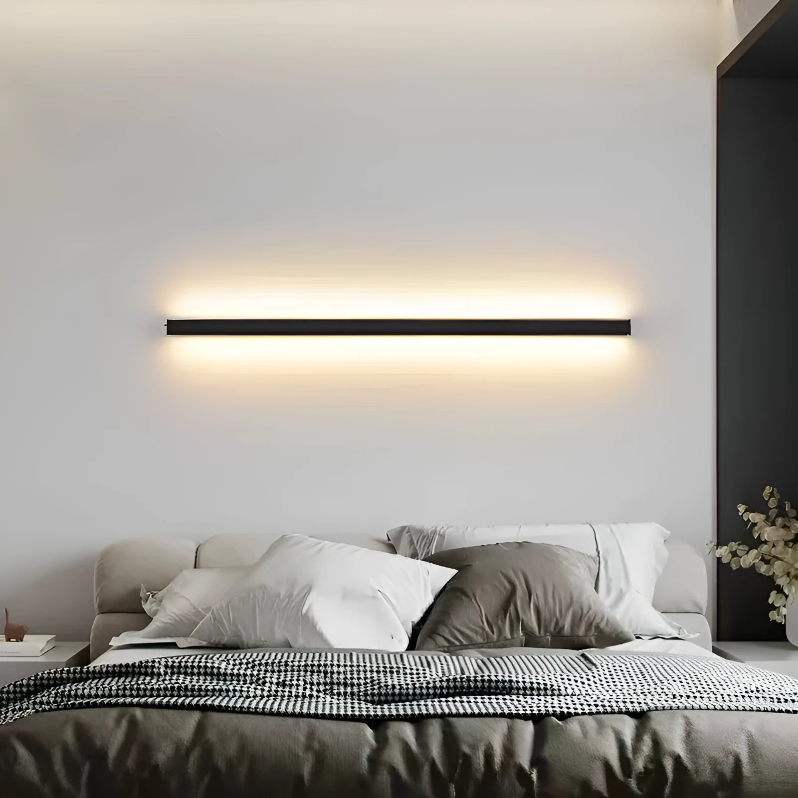 80cm long black simple strip LED wall lamp with touch control for three light colours on a wall.